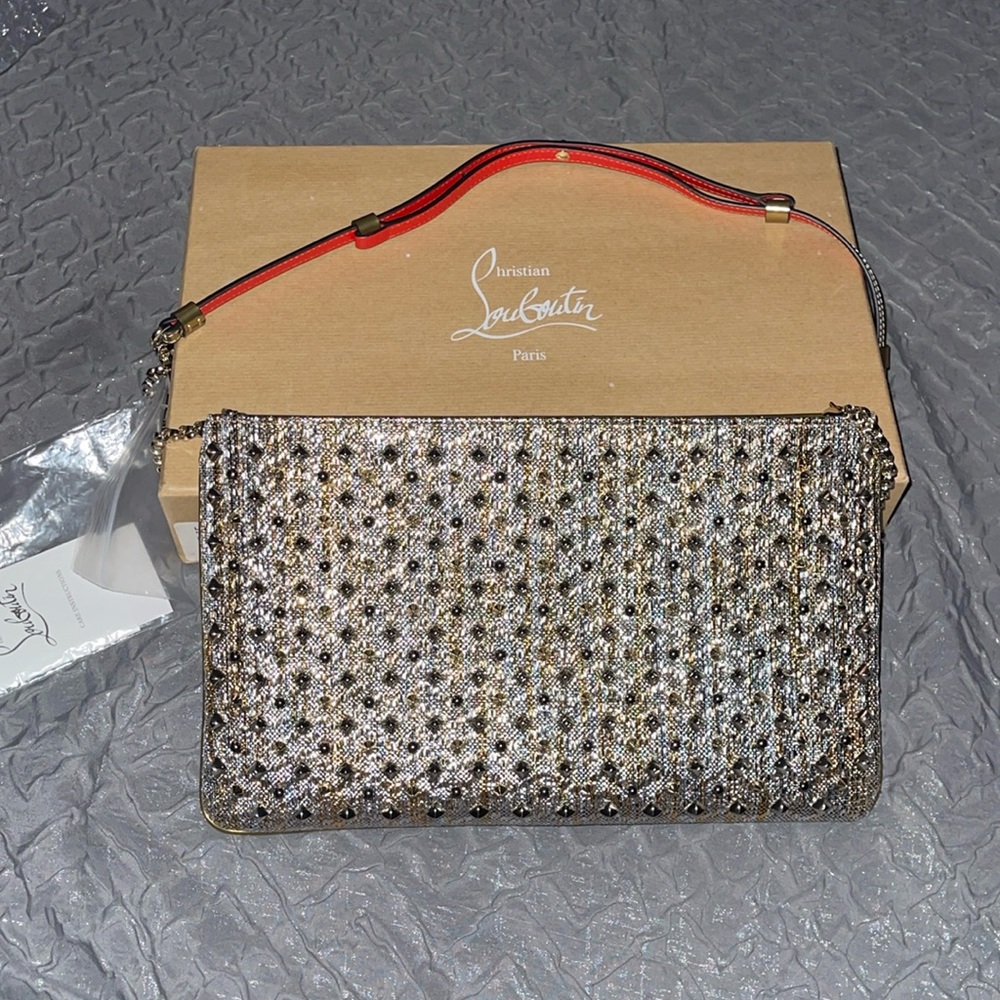 Preloved Louboutin clutch excellent condition size 12”W X 7 1/2”L silver n gold